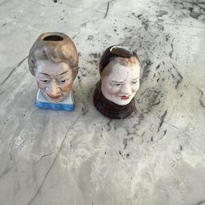 Pair of antique small figuring heads - perfect for candlestick or salt